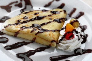 Crepes with chocolate and whipped cream.